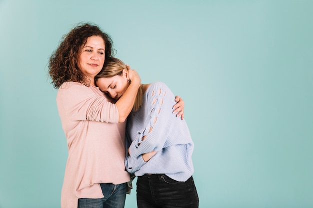 Mother comforting sad daughter Free Photo